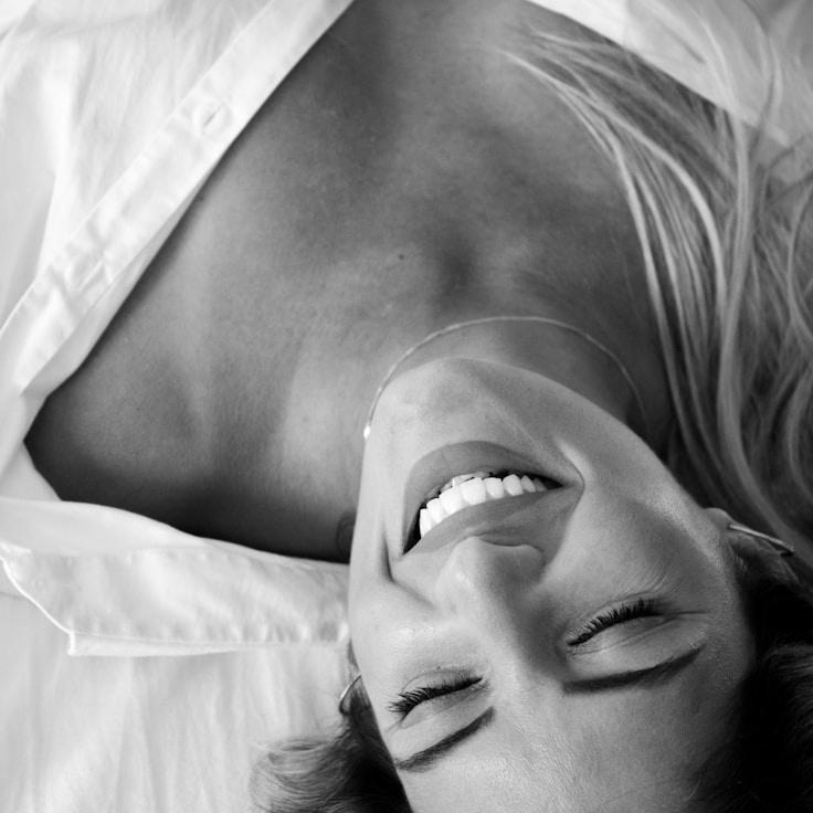 Mira Desai, Lead Design Curator at Sunset Mountain Path, reviewing corporate floral arrangements